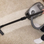 Home Close up of vacuuming a carpet